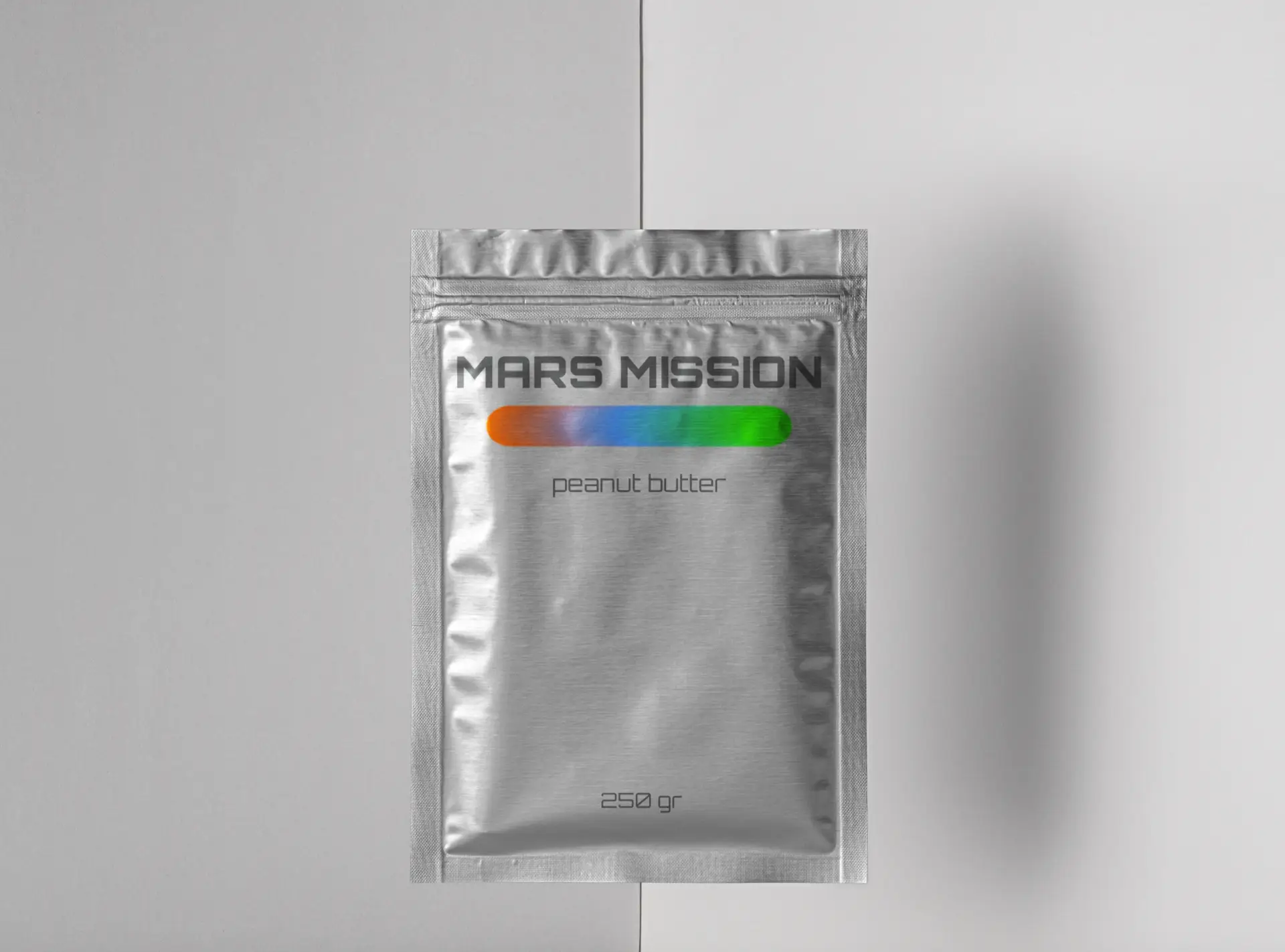 Silver food pouch labeled Mars Mission peanut butter with red-to-green gradient logo, representing sustainable nutrition for Mars colonization.