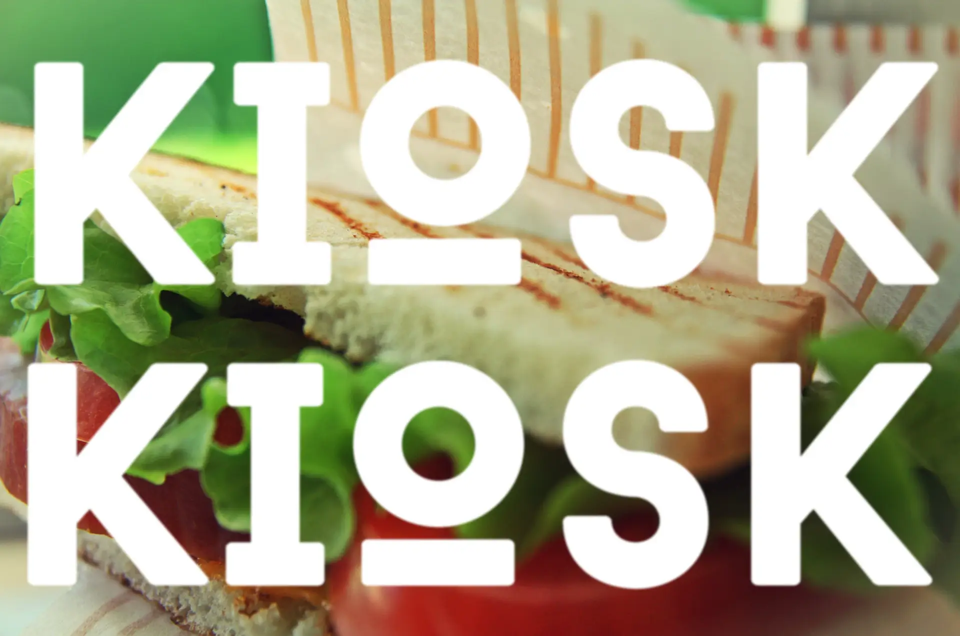 Sandwich with overlay of KIOSK brand lettering.